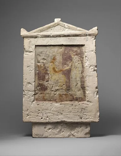 Painted limestone funerary stele with a seated man and two standing figures by Unknown Artist